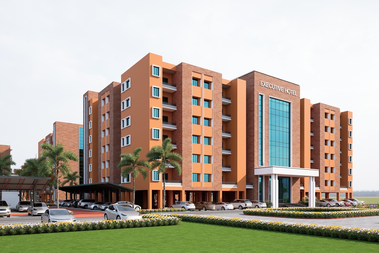 The executive hotel, in brick and terracotta render, with its glazed entrance tower and white portico