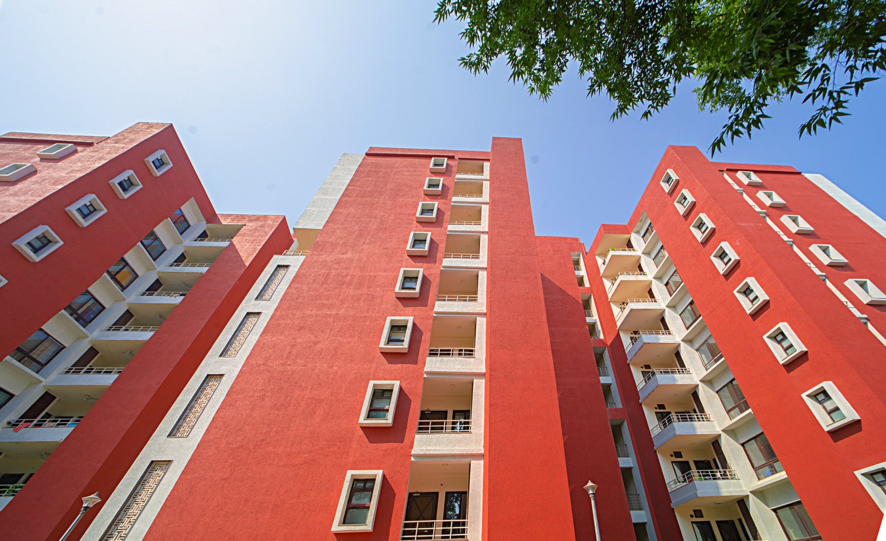 Looking up at the towers: terracotta walls and deep window frames